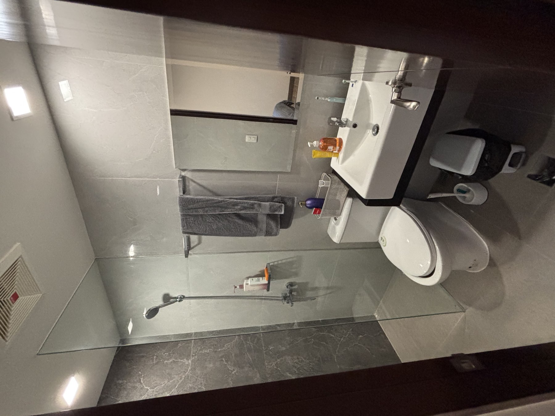Stone-clad ensuite bathroom off the primary bedroom of the DAYON TA condo